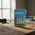 Paquete de cuatro pilas recargables AA Deleex de 1.2V en blíster sobre mesa de madera, marca ElectroSport 21 Spa